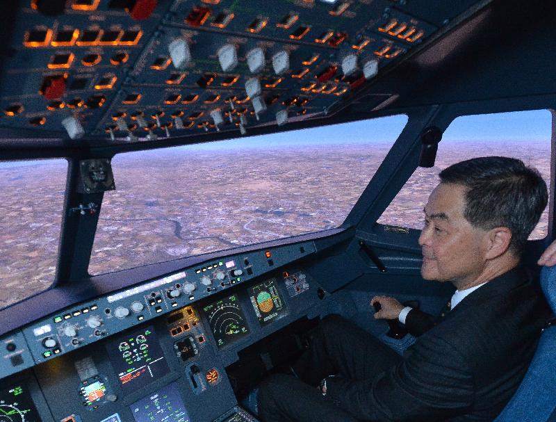 The Chief Executive, Mr C Y Leung, visited Ecole Nationale de l'Aviation Civile (National School of Civil Aviation) in Toulouse, France, today (June 7, Toulouse time). Picture shows Mr Leung trying out the pilot training simulator. 